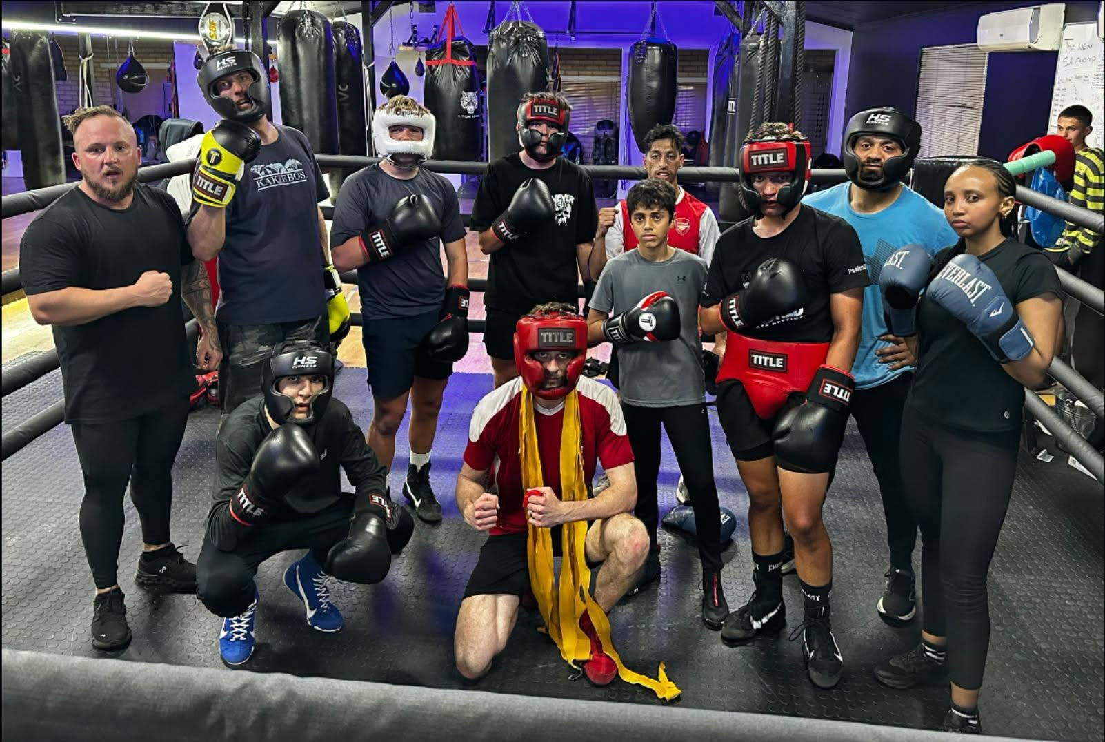Boxers in headgear standing in the ring at El Tigre